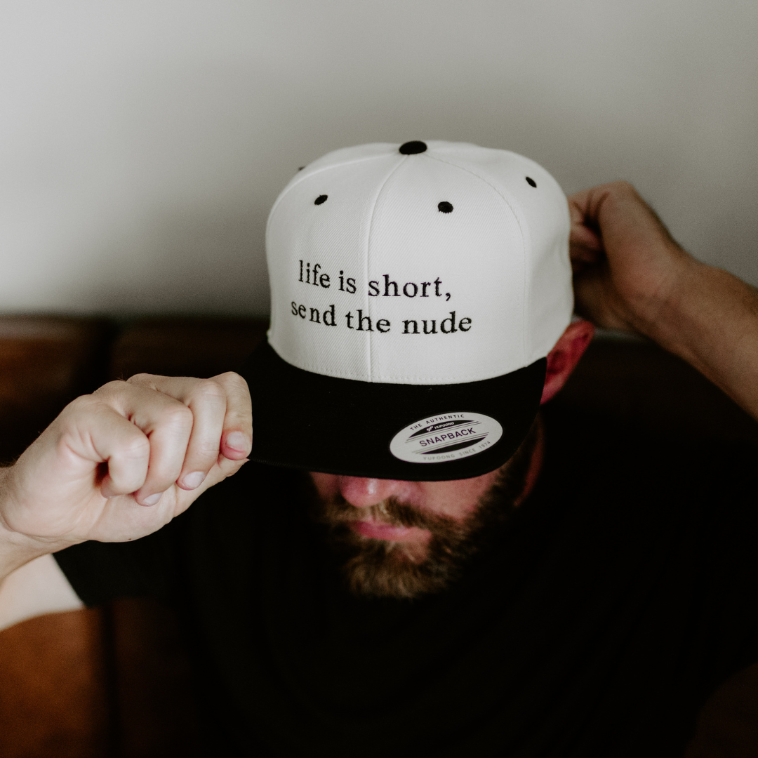 Send the N*de Black Snapback